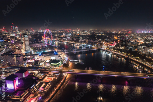 Epic night aerial view of the London  River Thames  London Eye  Westminster. Panorama cityscape