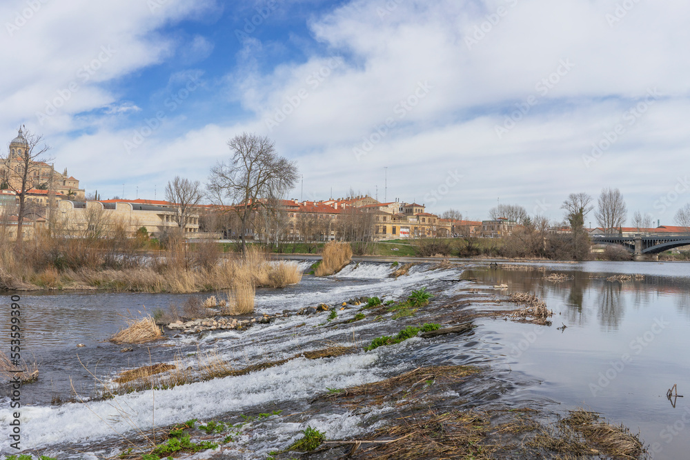 Tormes River flowing through the city of Salamanca (Spain).