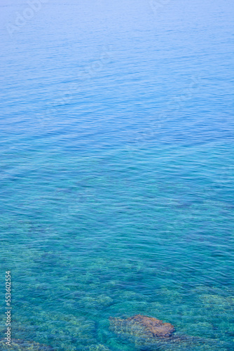 Background with sea surface with stone underwater