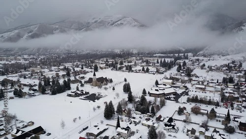 Afton, Wyoming during winter after a snow storm as fog and clouds hid the mountains in Star Valley. photo