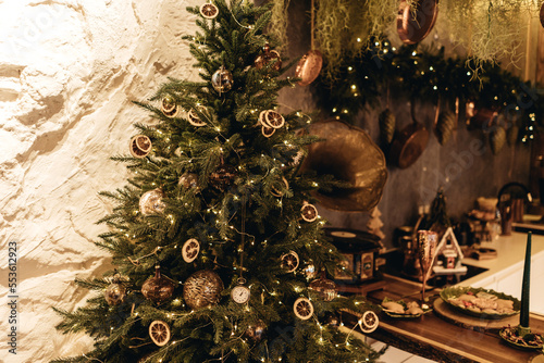 Christmas decor in the kitchen in a vintage style.  gingerbread house and cookies