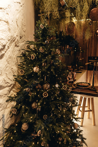Christmas decor in the kitchen in a vintage style.  gingerbread house and cookies