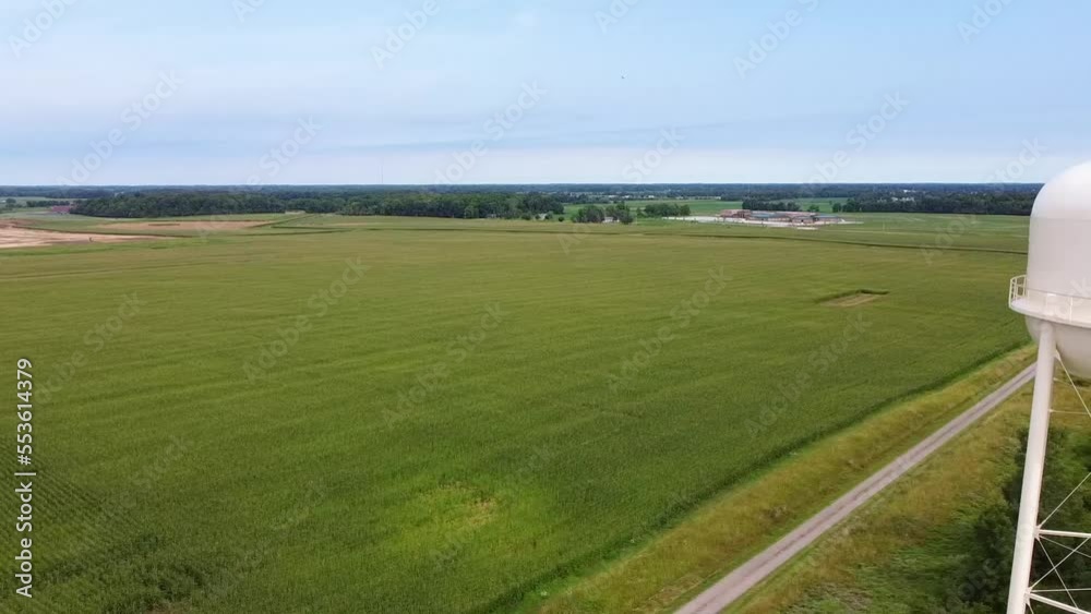 Aerial pan at Huntertown, Indiana water tower with farming fields surrounding Aerial pan at Huntertown, Indiana water tower with farming fields surrounding