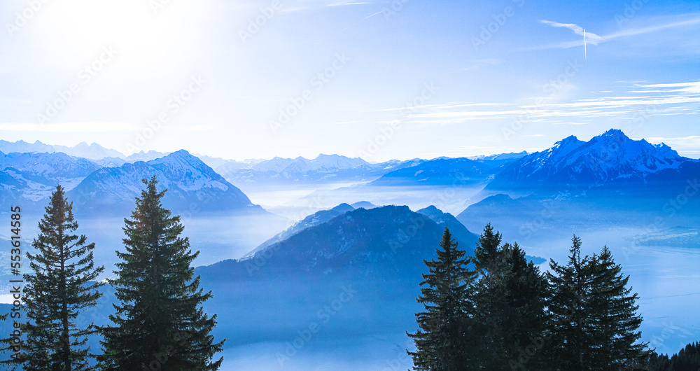Swiss Alps Mount Pilatus towering over foggy misty Vierwaldstattersee, Lake Lucern, Rigi, Switzerland
