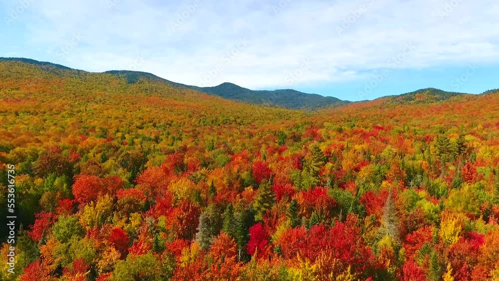 Aerial backwards across stunning Vermont peak fall hills and mountains Aerial backwards across stunning Vermont peak fall hills and mountains