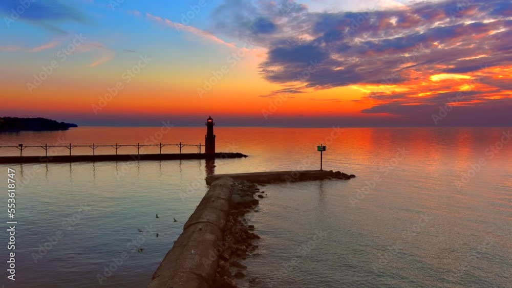 Dramatic twilight with stunning Lighthouse reflected in water's surface, dawn aerial view.
Dramatic twilight with stunning Lighthouse reflected in water's surface, dawn aerial view.