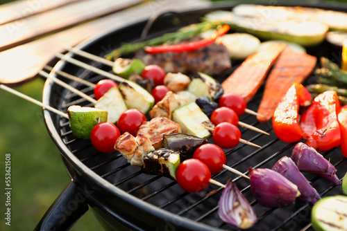 Delicious grilled vegetables on barbecue grill outdoors, closeup