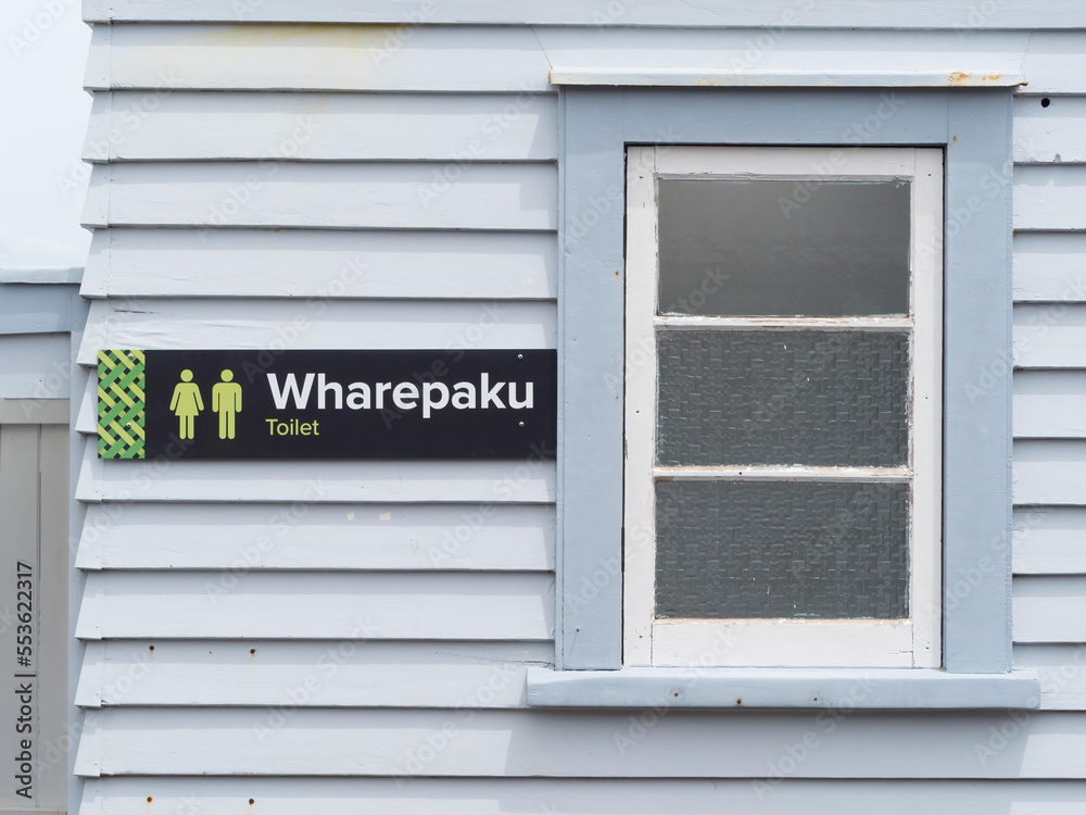 A toilet sign in Maori native language of New Zealand. Wharepaku. Male and Female StockFoto