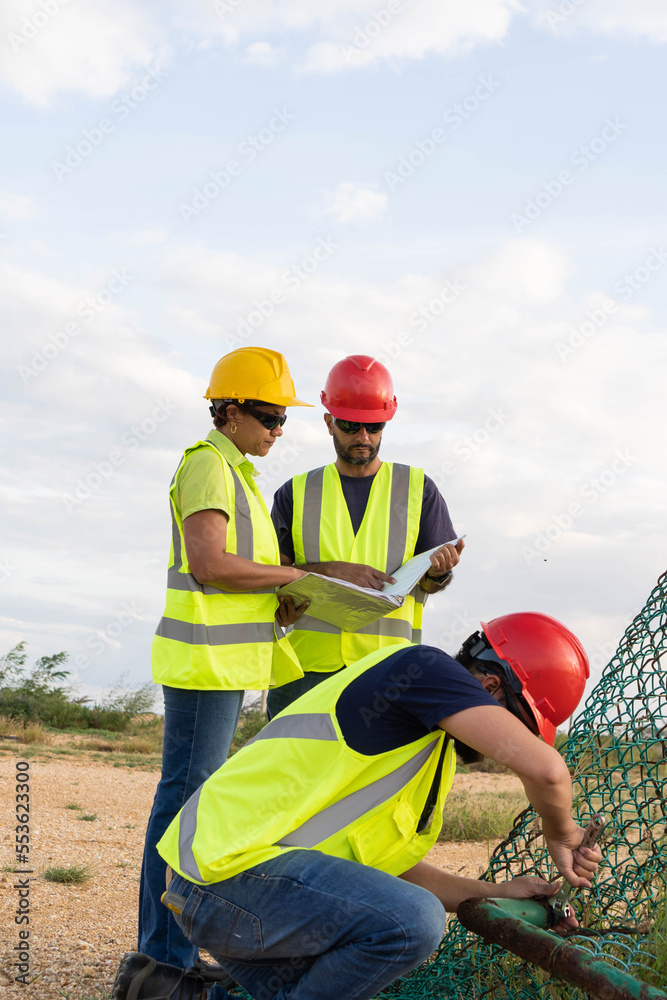Industrial engineers working in an industrial park Industrial engineers working in an industrial park