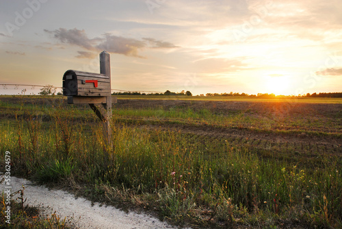 a mailbox in the heartland at sunset photo