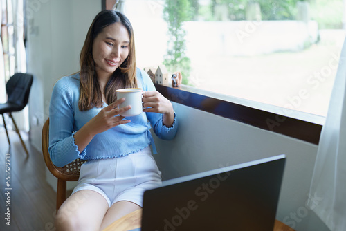Free Download business woman sitting and drinking coffee and smiling happily - GFXLoad