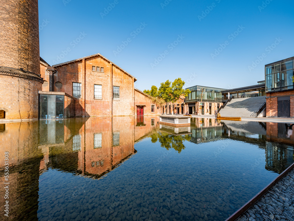 Red old factory building by the water, red brick house，Jingdezhen, Jiangxi, China,