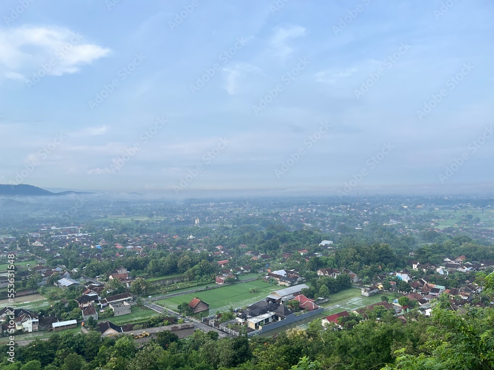 Beautiful aerial view from the top of Gunung Wamgi which is one of tourism destination in Yogyakarta, Indonesia. Photo shows established communities and nature.