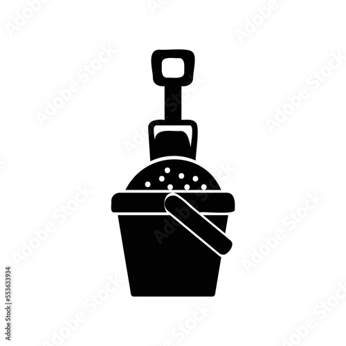 Icon of bucket filled by sands and shovel stick on it
