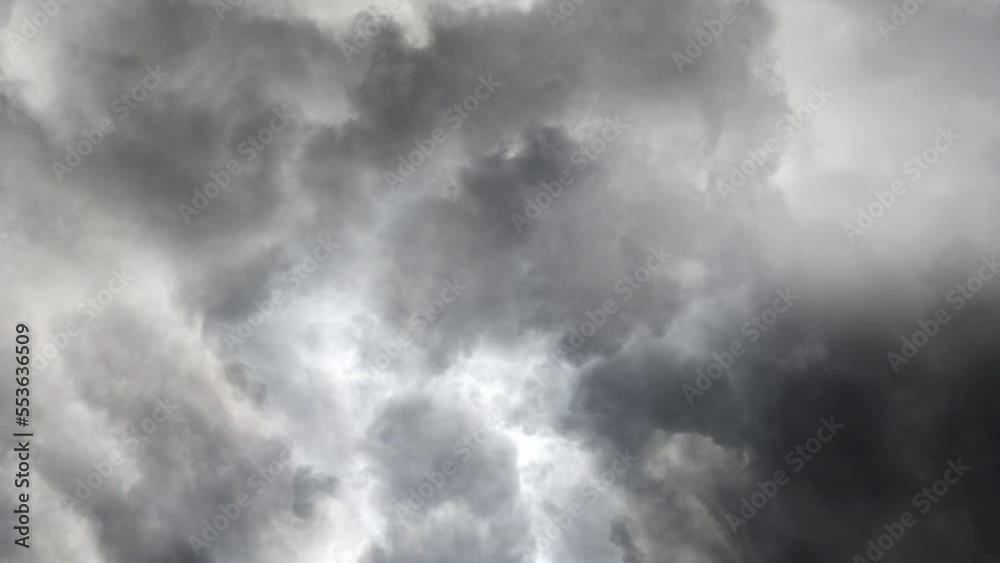 lightning strike in a thunderstorm in dark cumulonimbus clouds lightning strike in a thunderstorm in dark cumulonimbus clouds
