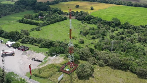 aerial shot with drone making a point of interest over a mobile phone antenna