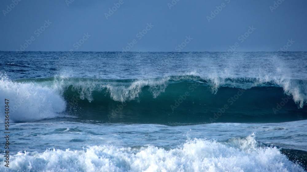 Waves breaking on the beach, in the morning, in Zipolite, Mexico