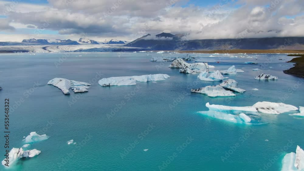 aerial view drone rising over glacier lagoon fill of icebergs jokulsarlon iceland sunny day aerial view drone rising over glacier lagoon fill of icebergs jokulsarlon iceland sunny day