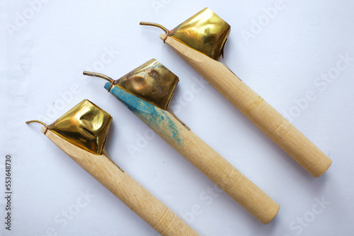 Canting is a tool used to move or remove fluids that are typically used to make written batik