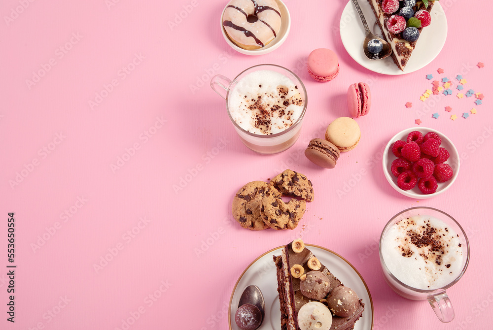 Table with various cookies, donuts, cakes, coffee cups on pink background. Table with various cookies, donuts, cakes, coffee cups on pink background.