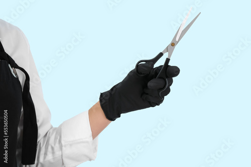 Female hairdresser with sci...