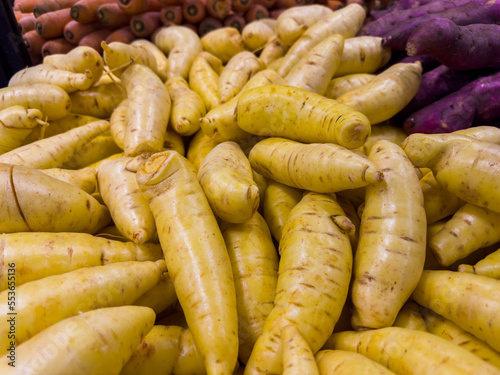 Fresh yellow baroa potatoes in the supermarket. Vegetables and fruits exposed for consumer choice. Brazilian hortifrutti photo