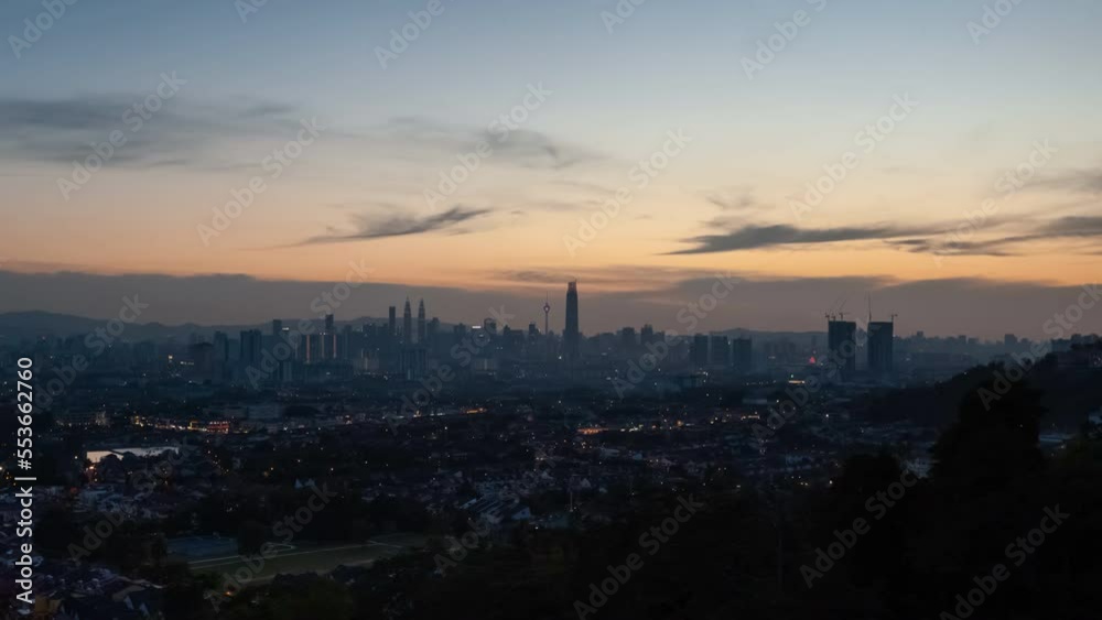 Aerial Time lapse: Kuala Lumpur city skyline view during sunset with busy city streets at dusk in Malaysia. Prores 4KUHD Timelapse. Aerial Time lapse: Kuala Lumpur city skyline view during sunset with busy city streets at dusk in Malaysia. Prores 4KUHD Timelapse.