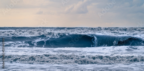 Storm sea waves with foam. Dramatic ocean landscape.