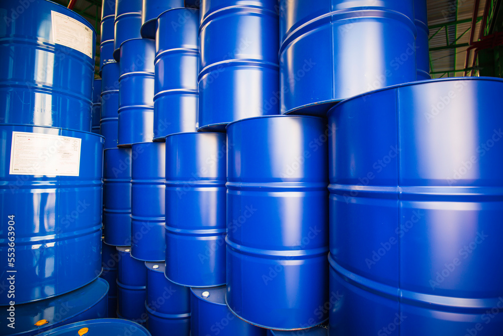 Oil barrels blue or chemical drums vertical stacked Oil barrels blue or chemical drums vertical stacked