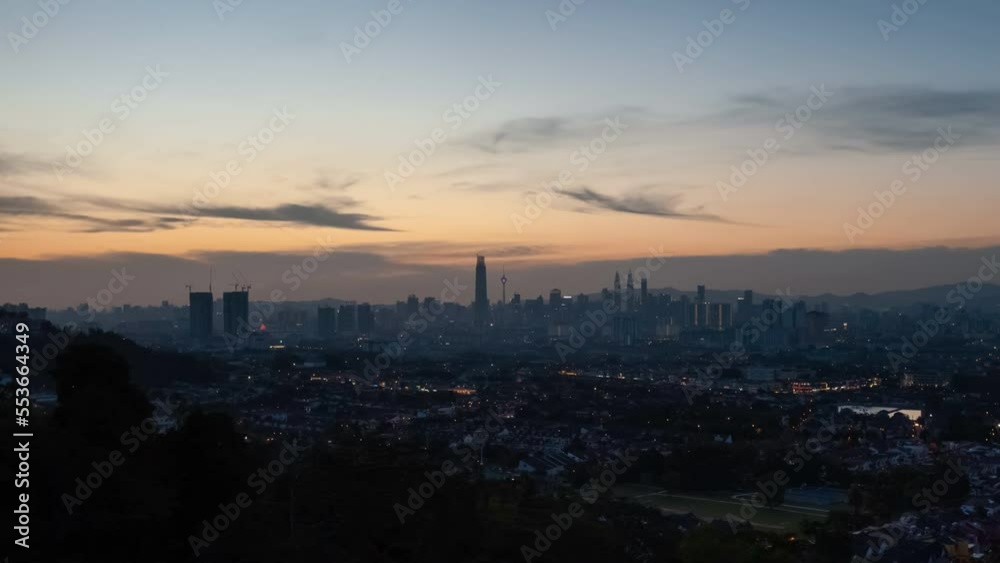 Aerial Time lapse: Kuala Lumpur city skyline view during sunset with busy city streets at dusk in Malaysia. Prores 4KUHD Timelapse. Aerial Time lapse: Kuala Lumpur city skyline view during sunset with busy city streets at dusk in Malaysia. Prores 4KUHD Timelapse.