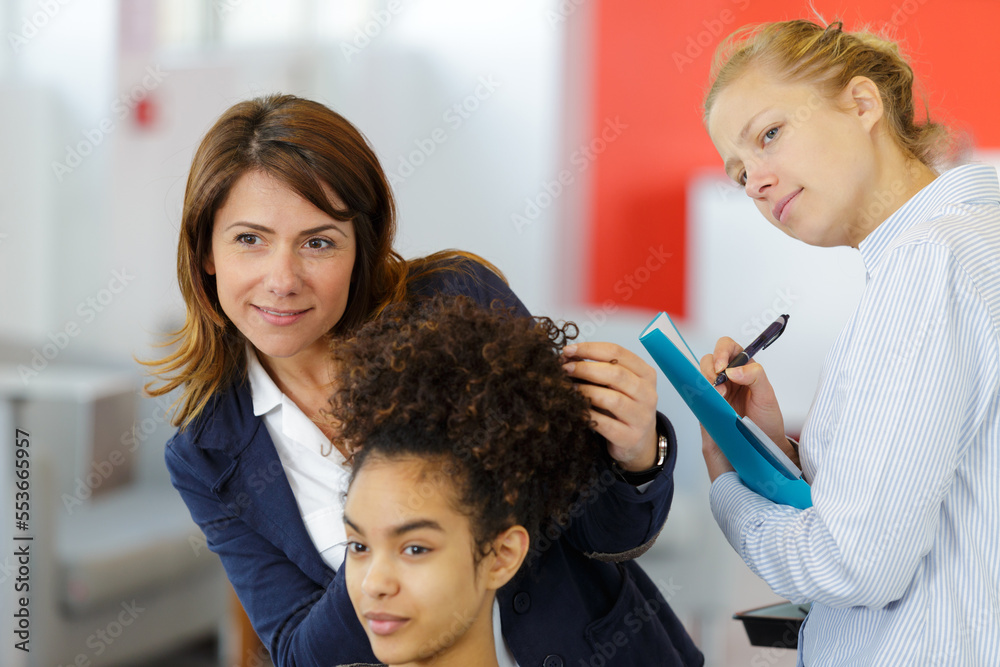 young woman checking the hairstyle done