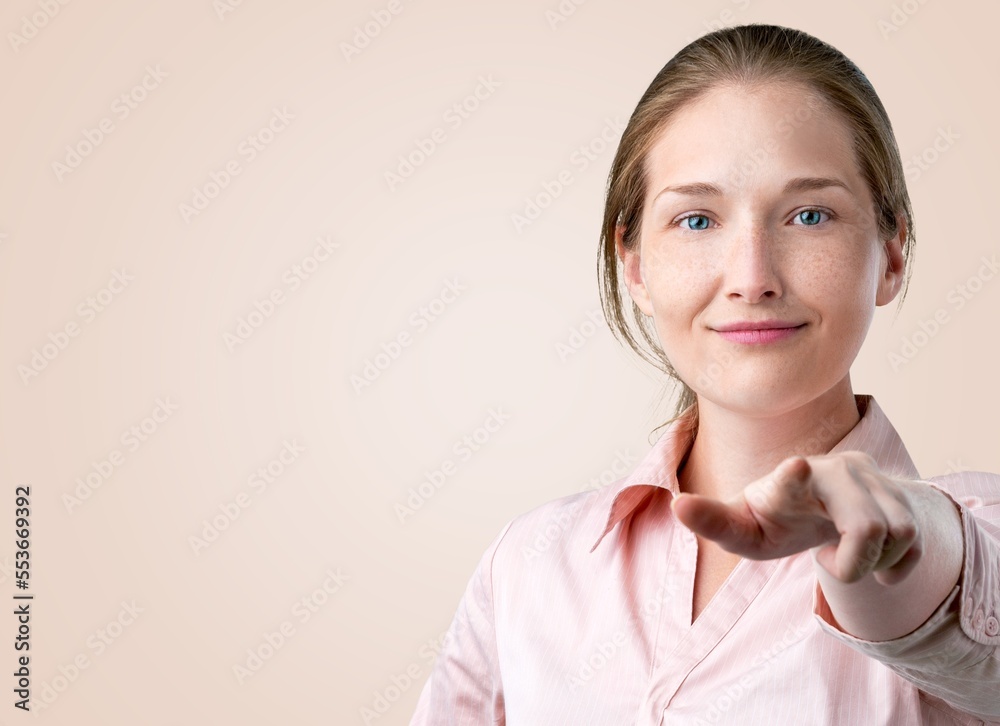 Young happy woman pointing fingers for you. Motivating concept. Young happy woman pointing fingers for you. Motivating concept.