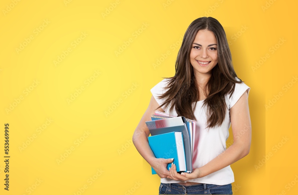 Young smart student with books, university concept Young smart student with books, university concept