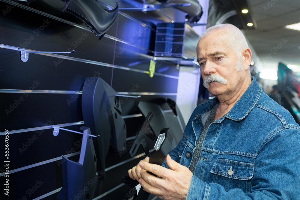 senior man in furnishings retail store senior man in furnishings retail store