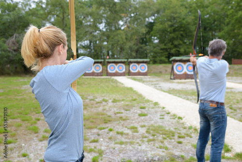 portrait of couple hitting the target