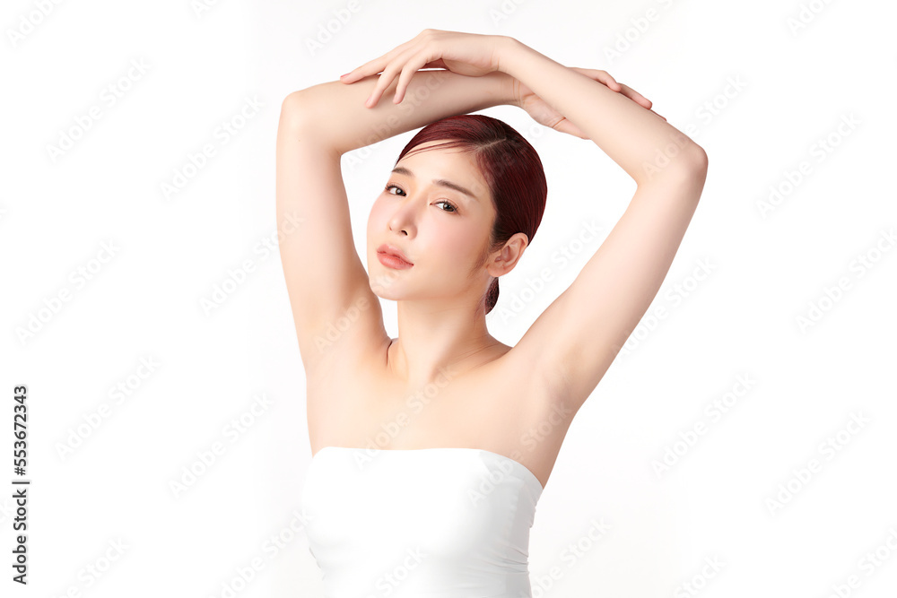 Beautiful Young Asian woman lifting hands up to show off clean and hygienic armpits or underarms on white background, Smooth armpit cleanliness and protection concept Beautiful Young Asian woman lifting hands up to show off clean and hygienic armpits or underarms on white background, Smooth armpit cleanliness and protection concept