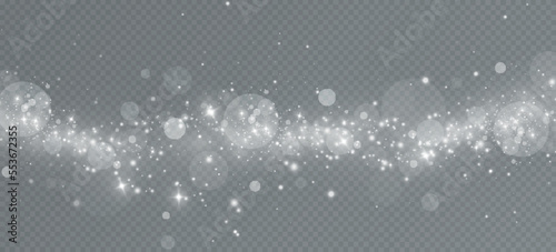 Light effect with glitter particles.Christmas dust.White sparks shine with special light.