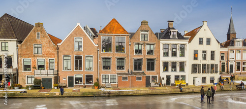 Row of historic houses at the frozen canal of Dokkum, Netherlands photo