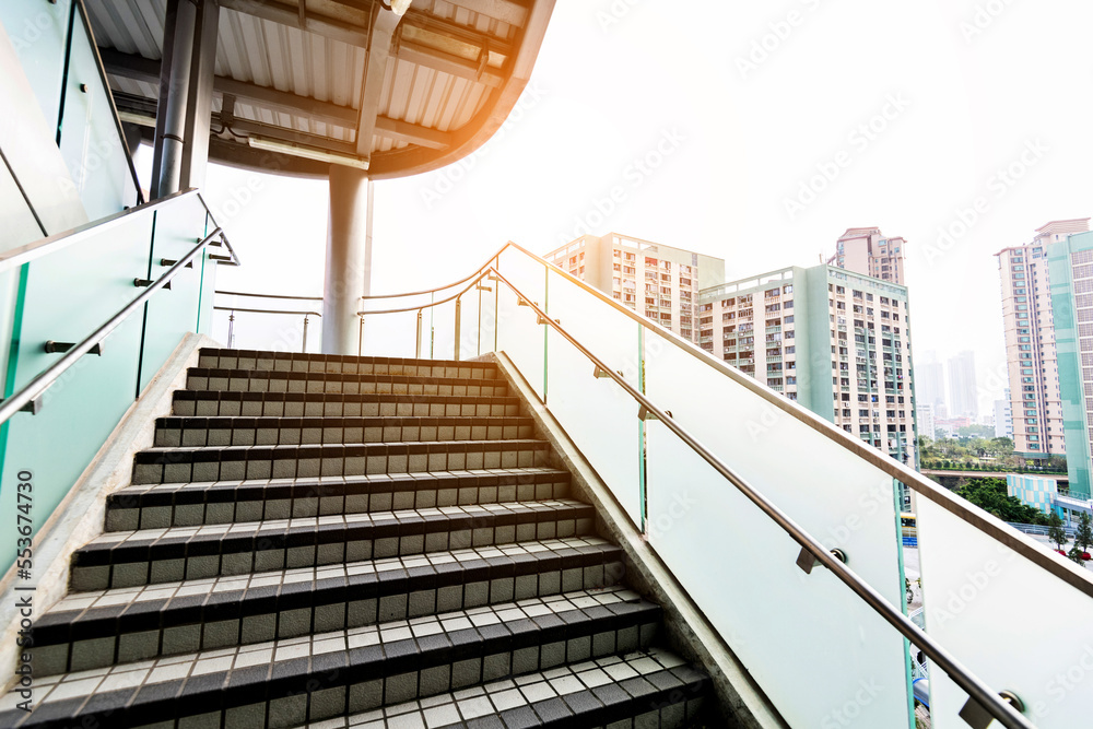 Staircase with glass railing in modern building Staircase with glass railing in modern building
