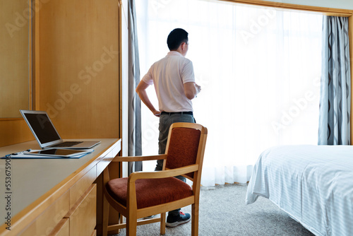 Man taking a break in front of the window