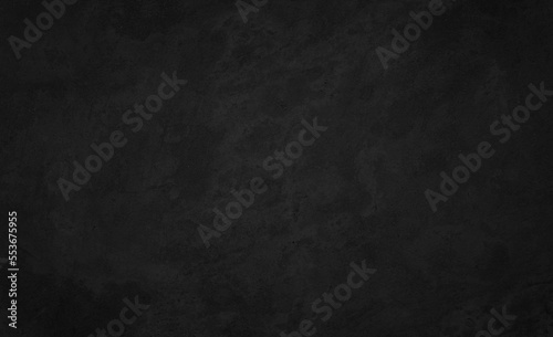 Art black concrete stone texture for background in black. Cement and sand grey dark detail covering. 