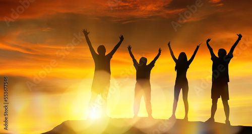 Silhouette family sports   Elderly parents and son daughter exercise  health care good health Raise your arms high  your mind is joyful and happy. exercise at sunset   happy family leisure 