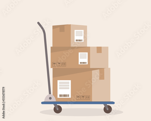 Side View Of A Hand Truck Loaded With A Stack Of Delivery Boxes.