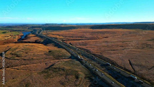 Aerial View of the M62 Motorway Ripponden near Windy Hill Oldham, On Saddleworth Moor. The highest Motorway in the UK. busy traffic and moorlands. Shot on a December afternoon. photo