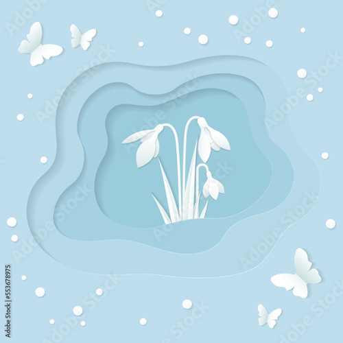 Spring greeting card in paper cut style with snowdrops and butterflies in blue and white on a layered background