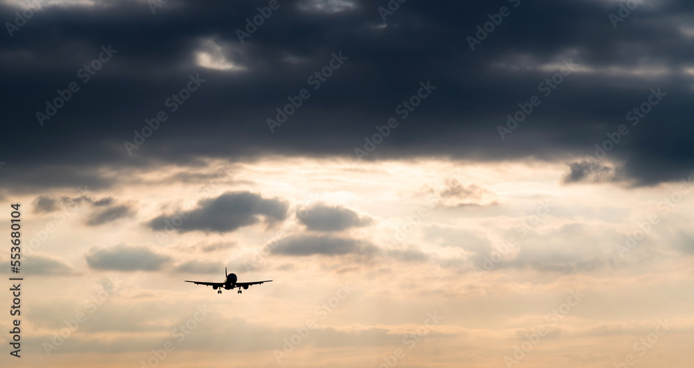 Airplane flying in overcast sky Airplane flying in overcast sky