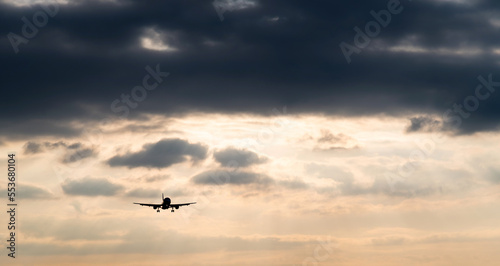 Airplane flying in overcast sky