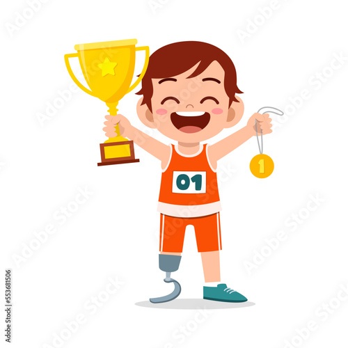 little kid with prosthetic holding medal and trophy