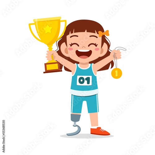 little kid with prosthetic holding medal and trophy