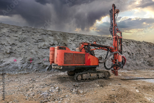 Excavator building a road in a site construction